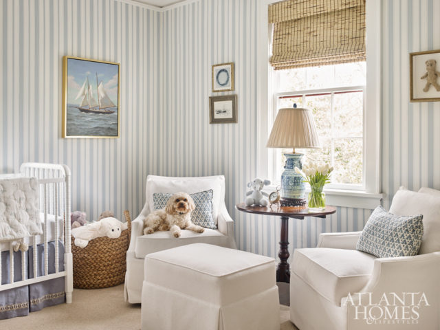 Brimming with charm, the nursery features wallpaper from Cole & Son. Like many of the home’s vintage and antique pieces, the dresser once belonged to the house’s previous owners. The chairs were purchased at Scott Antique Markets and the crib is from Wayfair. The crib skirt is custom. The fabric is from Ballard and the trim is Passementerie through Travis & Com