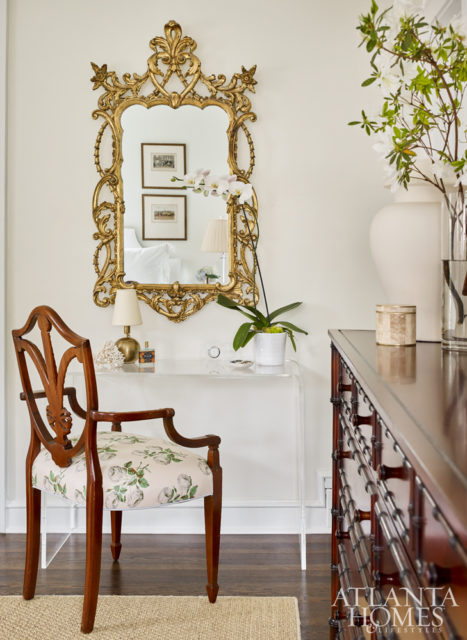 An ornate mirror hanging above CB2’s acrylic console showcases Lowe’s knack for effortlessly combining design genres.