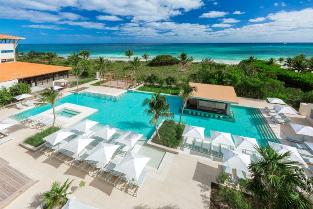 La Escondida, one of three pools at UNICO 20˚87˚ Hotel Riviera Maya, includes a hydro pool and plenty of seating.
