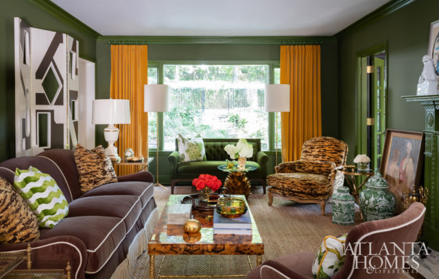 One of interior designer Melanie Turner’s favorite items in the house, a green velvet settee by Bernhardt Design, is part of an eclectic mix of furnishings that includes a comfortable chair covered in leopard fabric from Schumacher and a sofa from Lee Industries.