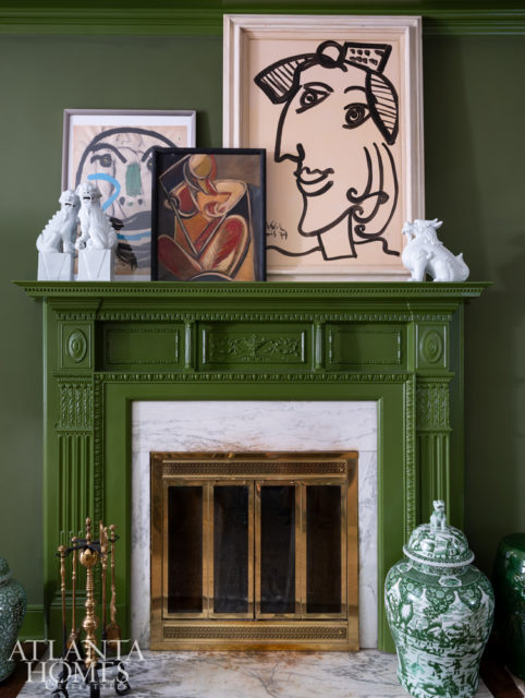 Cubist artwork and antique pottery read as one collection when grouped together.