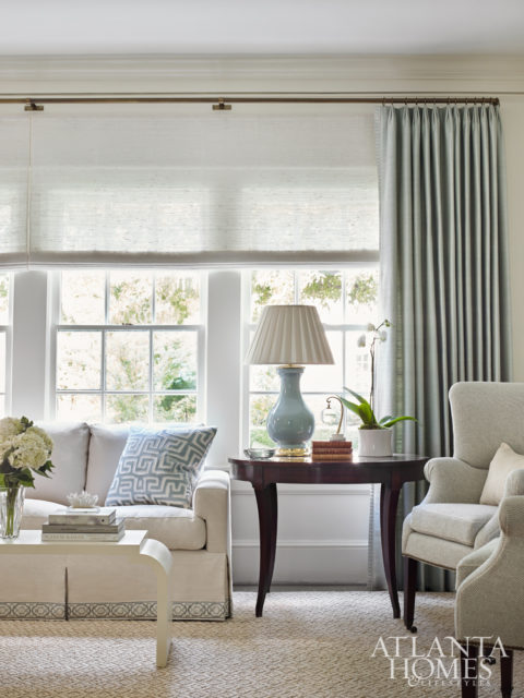 The tranquil color palette was inspired by the homeowner’s affinity for duck-egg blue. In the living room, the soft hue was incorporated into the Samuel and Sons sofa tape. The sofa is by Mr. and Mrs. Howard for Sherrill Furniture; the rug is Fibreworks.