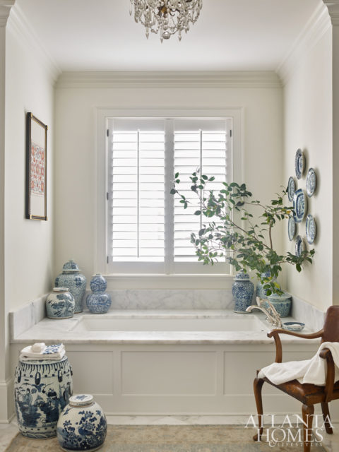 DeLoach incorporated pops of blue and white porcelain in the master bath.