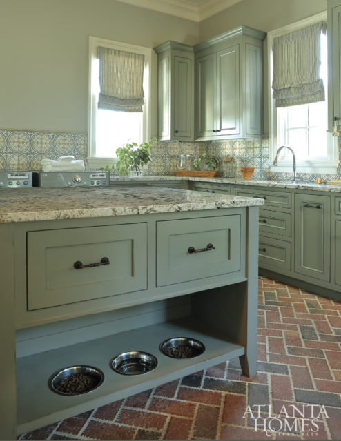 Durable brick pavers in the multipurpose laundry room are equal parts charming and functional.