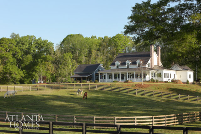 A series of outbuildings—such as the pool house and garage/guesthouse—captures the multigenerational feel of an older farmhouse.