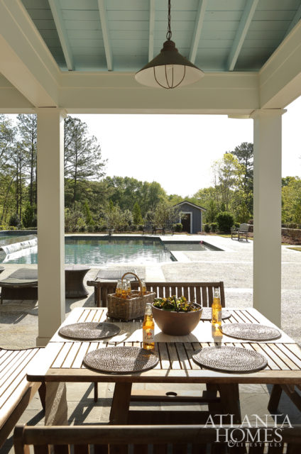 Its outdoor seating area features a pale blue ceiling for a dose of whimsy.