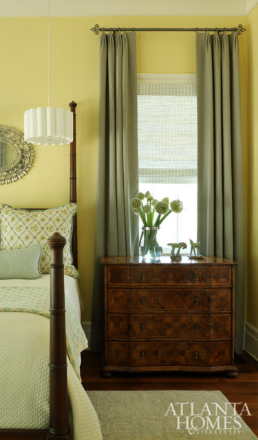 The master suite’s cheerful yellow palette was inspired by the wife’s request for a “bright and happy” room.