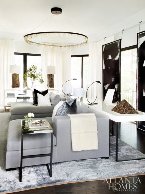 A peek into the master lounge reveals custom chaises by Dmitriy, black-and-white art from South of Market and a Christopher Boots chandelier from R Hughes.