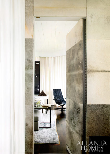 A peek into the master lounge reveals custom chaises by Dmitriy, black-and-white art from South of Market and a Christopher Boots chandelier from R Hughes.