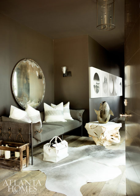 The home’s entry is enveloped in Sherwin-Williams Sealskin (SW 7675).