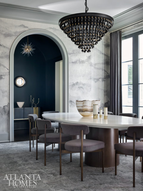 A striking, digitally printed wallcovering from Phillip Jeffries’ Beyond collection sets the stage for chic entertaining in the dining room. Other unique accents include a cascading chandelier from Restoration Hardware and an oversize rug from Moattar, Ltd. The chairs are by Mitchell Gold + Bob Williams.