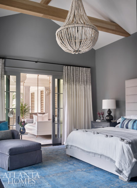 An overdyed Oushak rug from Moattar, Ltd. serves as the foundation for the master bedroom’s beach-inspired palette. A custom hanging bed located on the balcony also offers a breezy, coastal touch.