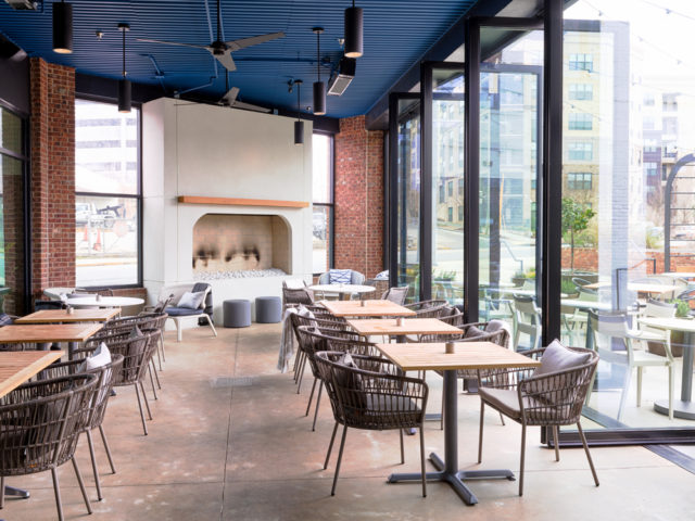 Complete with a gas-burning fireplace, Tin Tin’s covered patio conveys a relaxed feel.