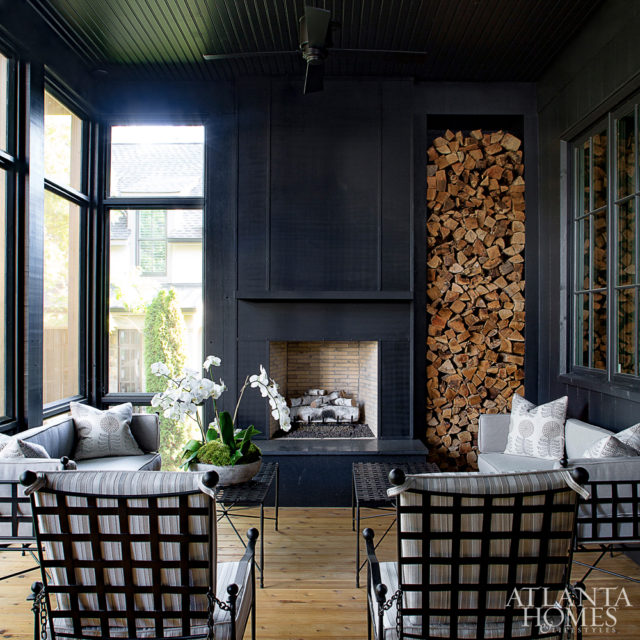 The homeowners often spend time watching football on the screened porch. The sofas and chairs are by Amalfi Living.