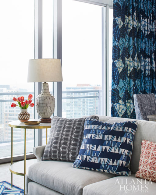 A vintage terracotta lamp from Max & Company adds to the condo’s layered appeal.