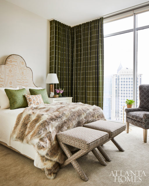 Pierre Frey’s embroidered Tasmania fabric served as the starting point for the guest bedroom’s design. To visually juxtapose its organic nature, Howard selected Zak + Fox’s more structured windowpane fabric, Postage, in olive green for the draperies. The benches are by Lee Industries.