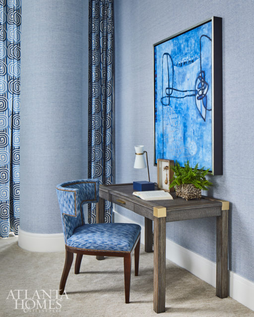 To make this bedroom’s structural column less conspicuous, Howard wrapped it in a Phillip Jeffries wallcovering. A desk by Palecek and chair by Mr. and Mrs. Howard for Sherrill Furniture offers the homeowner a quiet spot to work.