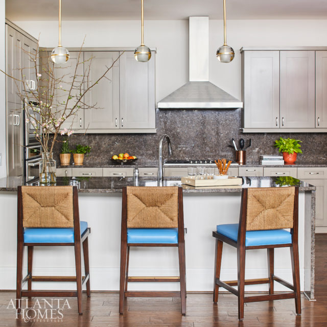 Howard dressed up the kitchen with Palecek stools and pendants from Arteriors.