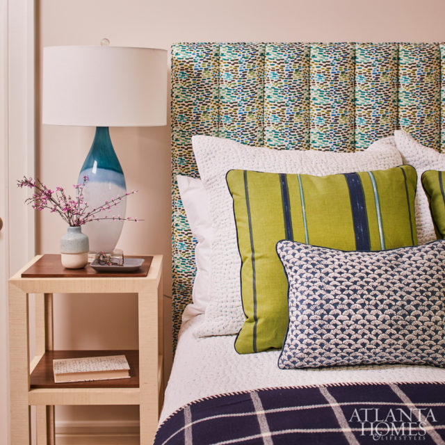 Designed with the homeowner’s grandchildren in mind, Howard selected a playful Ferrick Mason fabric for the headboard.