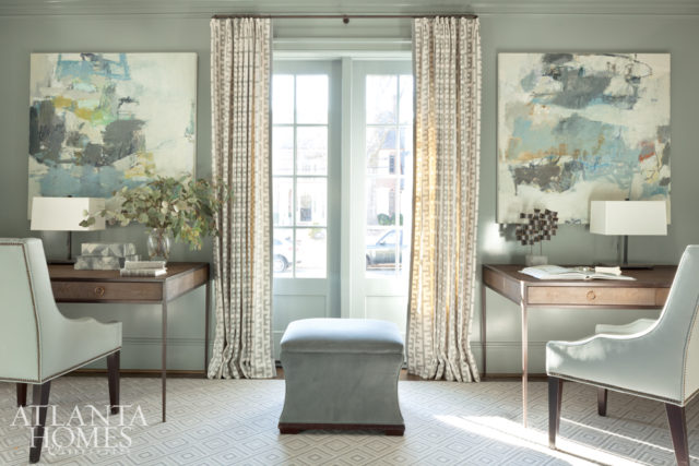 The lacquered library, inspired by a pair of Jenny Nelson paintings, is painted in Benjamin Moore’s Puritan Gray. The upholstered desk chairs and ottoman are Charles Stewart.
