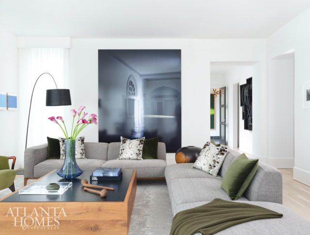 A large-scale photograph by James Casebere anchors the living room, where the Wielands entertain guests. Interior designer Julie Witzel and Skylar Morgan Furniture custom-designed the coffee table.