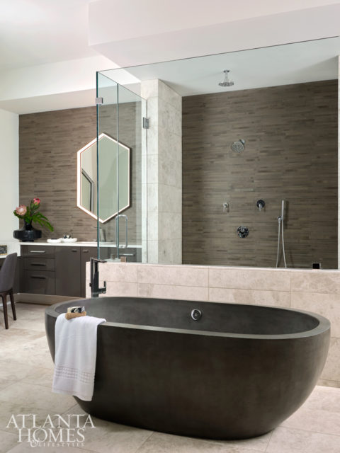 Witzel specified a cast stone and resin tub in the master bathroom; custom Studio Endo mirrors featuring built-in LED lighting were used in lieu of sconces.
