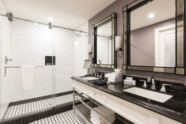 A guestroom’s en suite bathroom—an elegant throwback to the 20s.