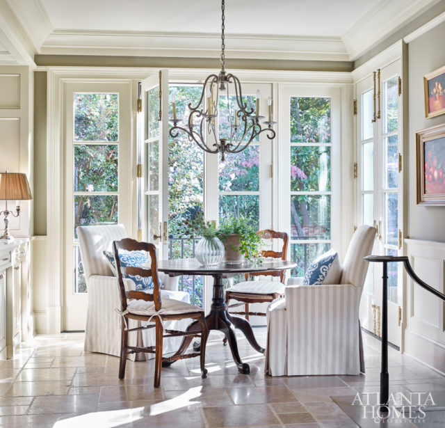 Natural light floods into a cozy breakfast nook.