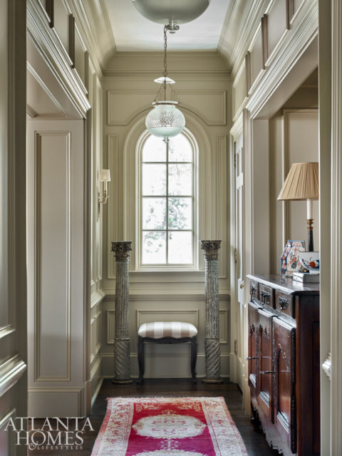 A corridor off the family room showcases the wife’s Imari porcelain collection.