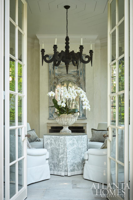 Inspired by a photo of boiserie in an old French château, Bryan commissioned The Finishing Source to repaint the client’s existing trumeau mirror. Unique accents such as a limewashed chandelier by Koektrommel adds to the folly’s worldly appeal.