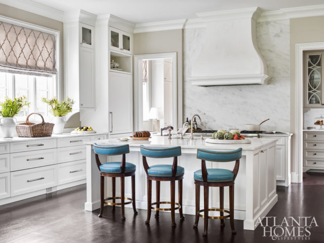 White cabinetry is accented by a linen fabric with a velvet overlay from Mark Alexander. The kitchen was designed in partnership with Cynthia Ziegler.