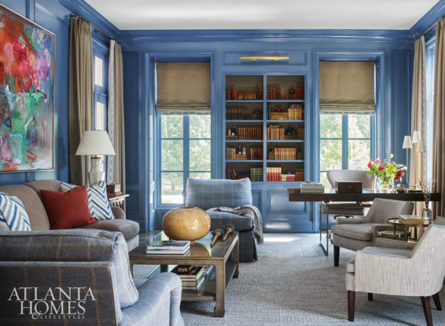 Lacquered paneled walls are balanced by textural fabrics, which include draperies and roman shades made of wool from Holland & Sherry with a cut velvet trim from Cowtan & Tout. The desk is Julian Chichester.
