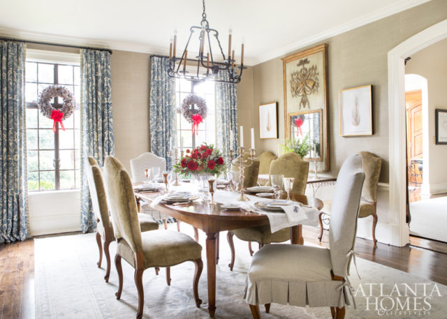 A Schumacher grasscloth adds texture to the dining room walls. The chair slipcover fabric is by Carleton V and the Oushak rug is Moattar. The silver pedestal basket is from Beverly Bremer.