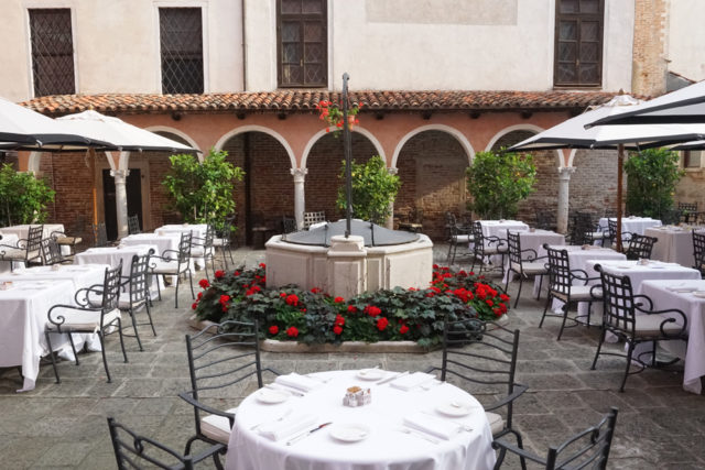 The hotel’s restaurant is nestled next to the historic church.