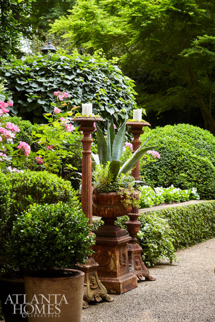 Treasures include antique candelabras and an urn with seasonal plantings.