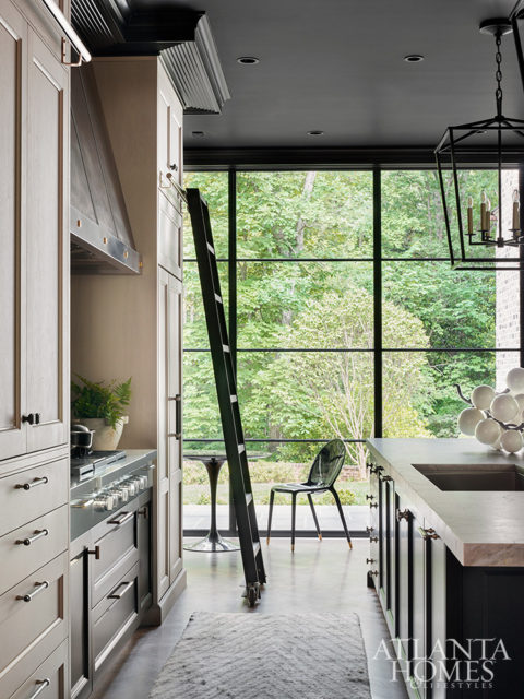 Avalanche quartzite countertops and hardware by Matthew Quinn Collection elevate the handsome island from Downsview Kitchens by Design Galleria Kitchen and Bath Studio.