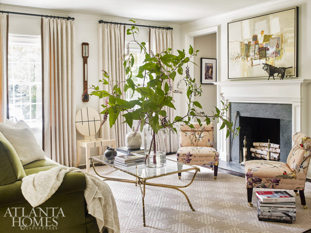 Decorator Betty Burgess complemented the home’s leafy surroundings with Clarence House’s pink floral linen gracing a pair of slipper chairs and a green velvet covering the sofa.
