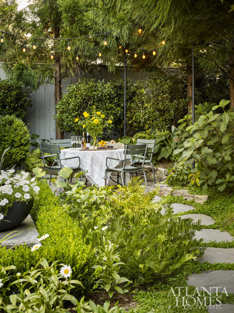 Howard Design Studio turned a little used space of the backyard into a dining area for casual lunches and dinners. The table and chairs are manufactured in France for Fermob.