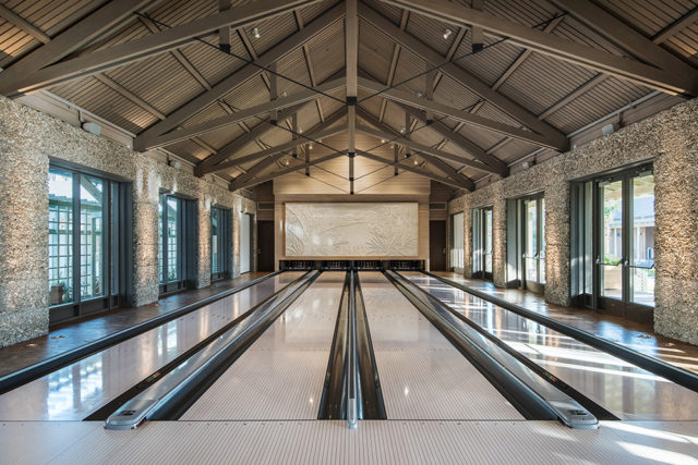 Winning Detail Walls of glass and tabby connect the bowling alley to the outdoors. Additionally, 4240 worked with Brunswick to design gutters that can be swapped with floor panels converting the bowling alley into an event space.