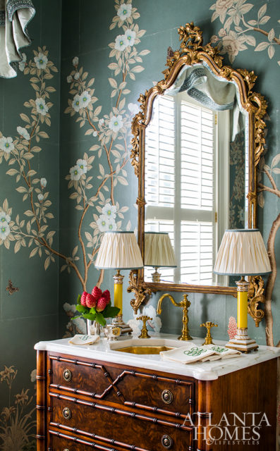 A powder room by Mallory Mathison Glenn features native Georgia flowers on a custom Gracie wallcovering. Photo by Jeff Herr.