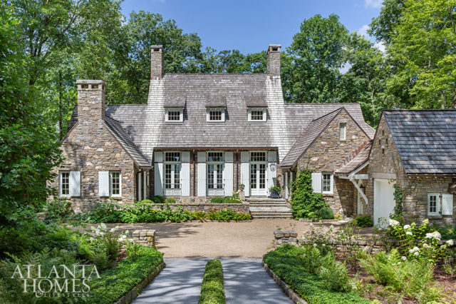 Built with native North Carolina fieldstone, this handsome retreat is a collaboration betweenarchitect D. Stanley Dixon, landscape architect John Howard and Betty Burgess of Betty Burgess Design.