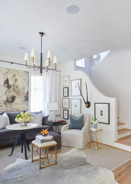 A mix of blue and cream hues, including on the Fitzgerald Sofa and Alexis Chair, both Atelier Home for Stock & Trade, soften a living area’s statement pieces.
