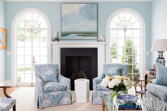 Architect Cathie Magnan Power and builder Brian Atkinson created clean lines for a contemporary feeling in the light-filled living room, which opens to a private courtyard designed by Richard Anderson. Swivel chairs by Kravet in a Travers ikat rest in front of a Paul Ferrante coffee table through Ainsworth-Noah.