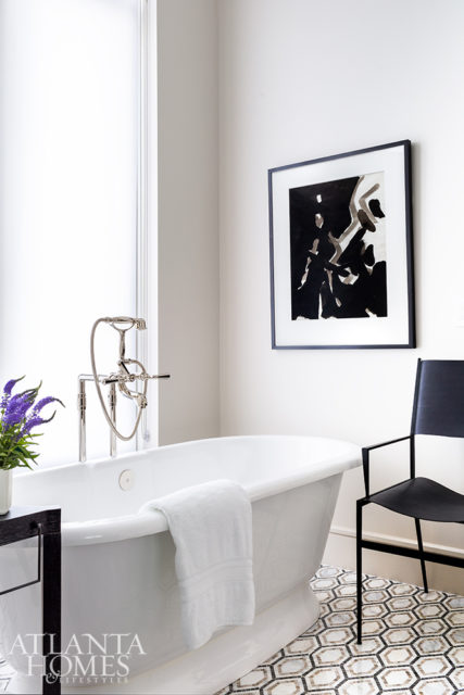 A shearling chair from B.D. Jeffries adds a finishing touch to the glamorous master bathroom.
