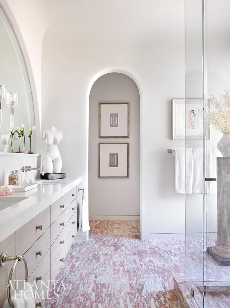 arched doorway in bathroom with eye-catching tile