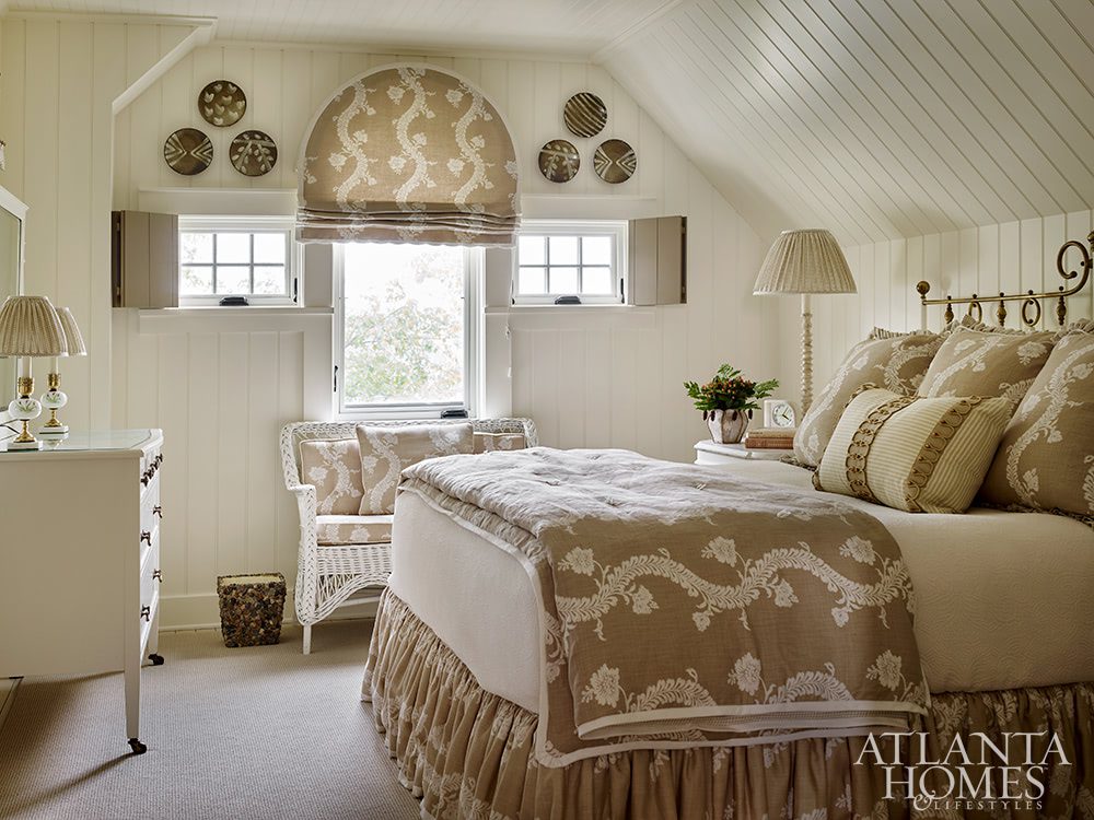 taupe and white bedroom with antique furniture