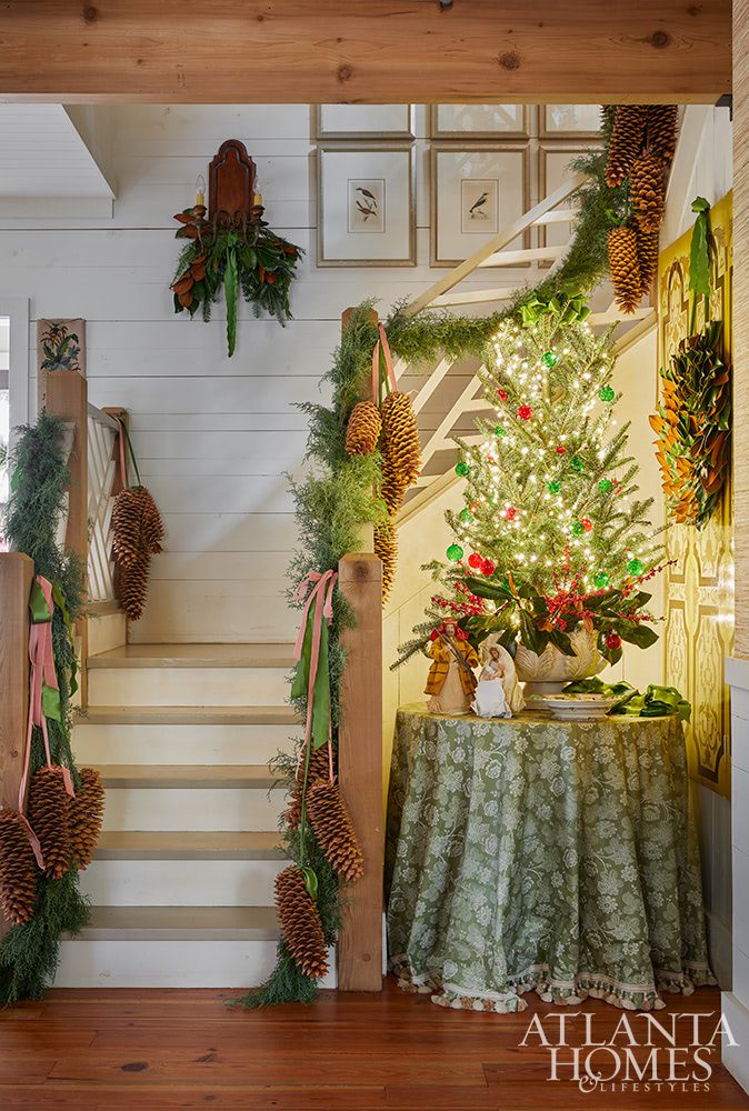 Christmas staircase decor with pinecones