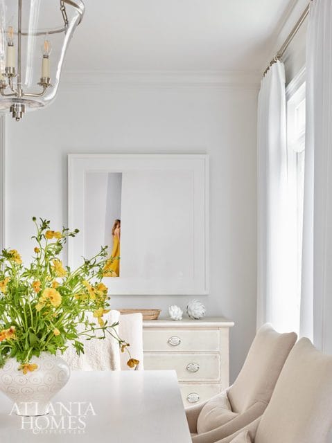 white dining room with art