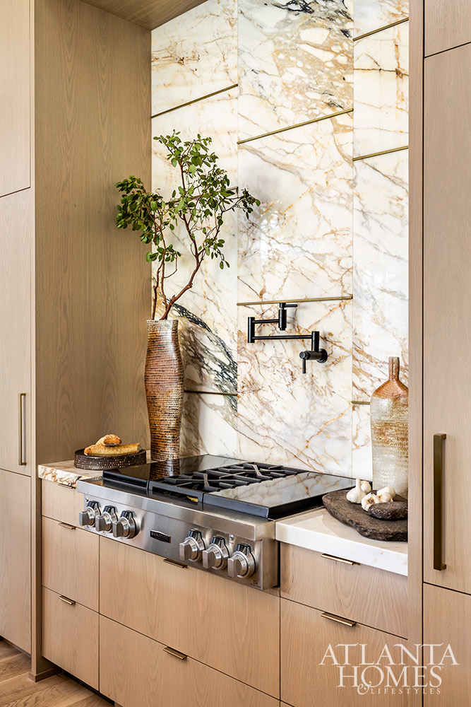 oak cabinets and marble backsplash stove