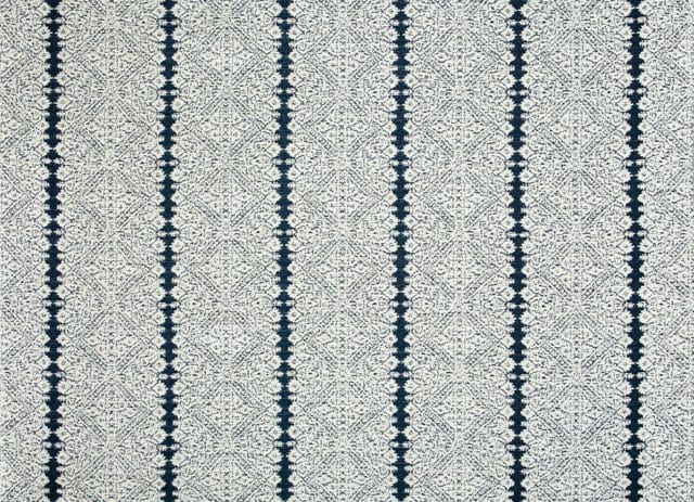 Textured fabric with a pattern of vertical navy blue stripes and a diamond-shaped geometric print.